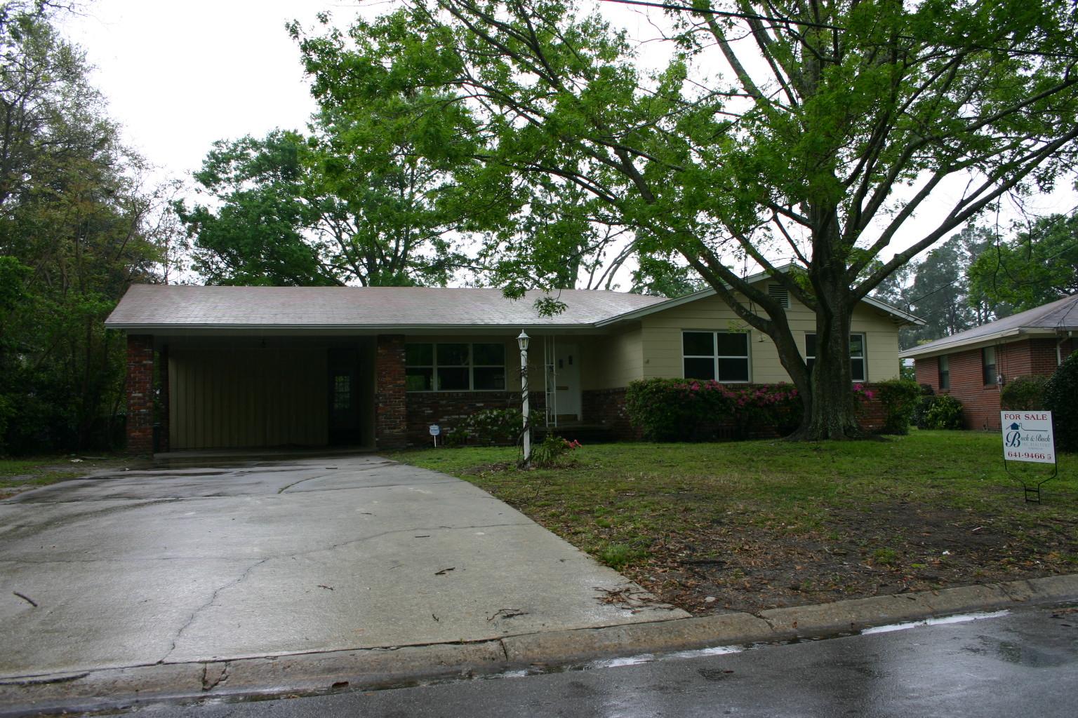 3640 Coronado Road Jacksonville, FL 32217 - Photo 1 of 1 a front view of a house with a yard and garage