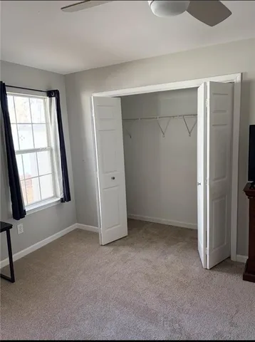 a room with furniture and a window
