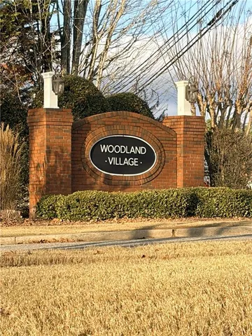 a sign board on the side of a road