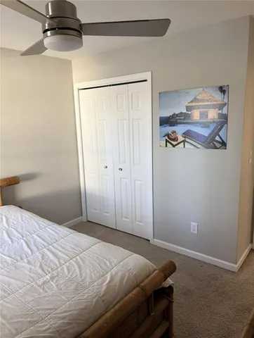 a bathroom with a toilet a sink and shower