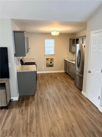 a living room with a couch and a flat screen tv