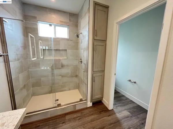 a bathroom with a glass shower door