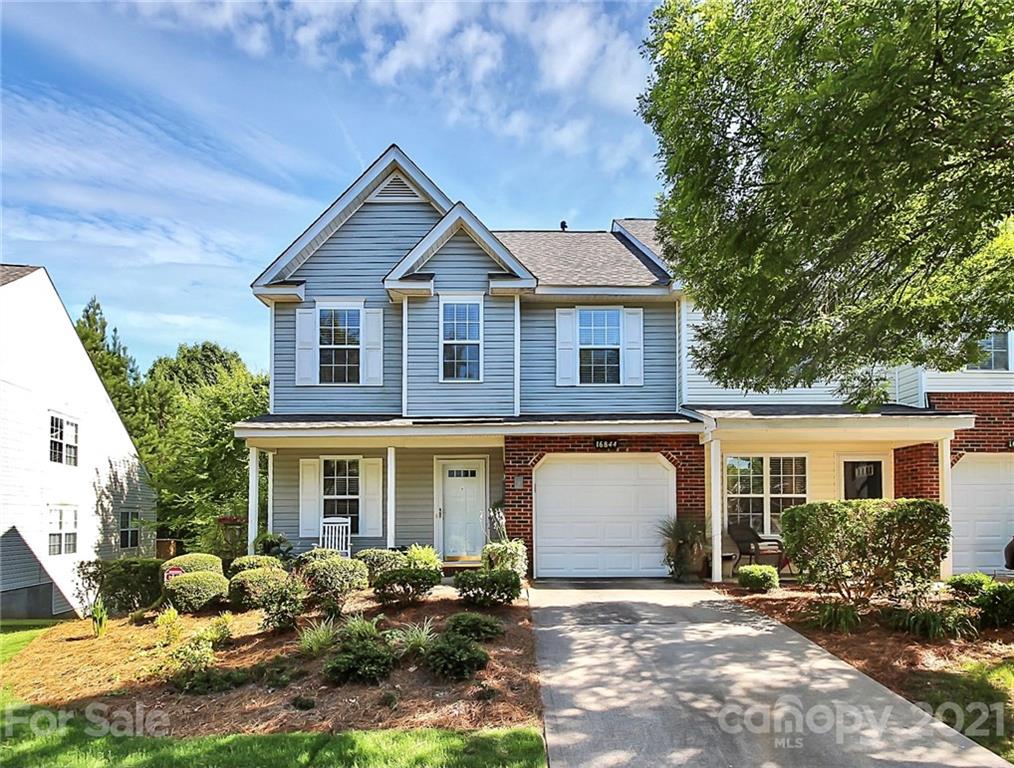 16844 Timber Crossing Road, Unit 2111 Charlotte, NC 28213 - Photo 1 of 33 a front view of a house with garden
