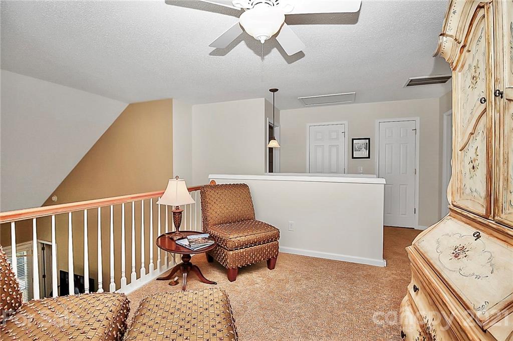 16844 Timber Crossing Road, Unit 2111 Charlotte, NC 28213 - Photo 16 of 33 a bedroom with furniture and a window