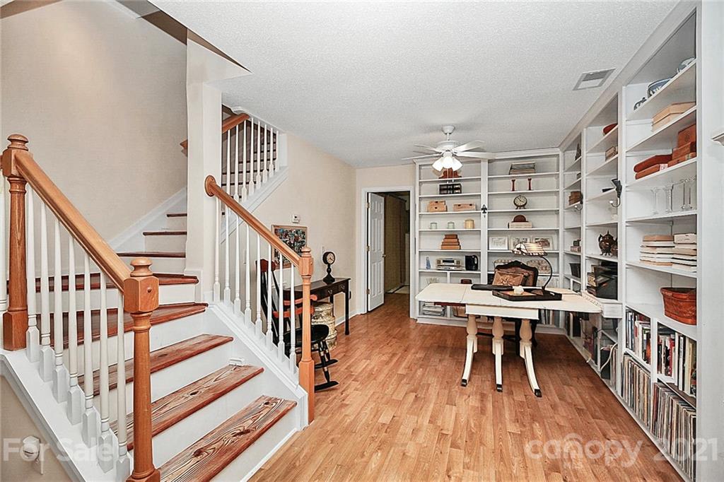 16844 Timber Crossing Road, Unit 2111 Charlotte, NC 28213 - Photo 22 of 33 a view of a room with lots of furniture and wooden floor