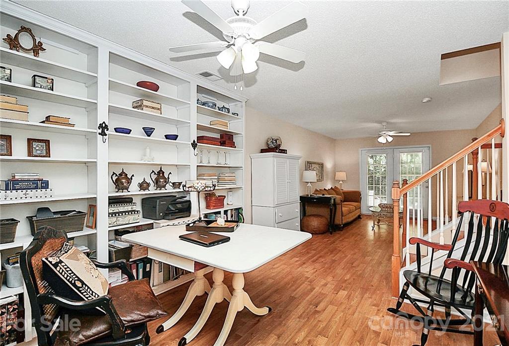 16844 Timber Crossing Road, Unit 2111 Charlotte, NC 28213 - Photo 27 of 33 a view of a dining room with furniture and a kitchen