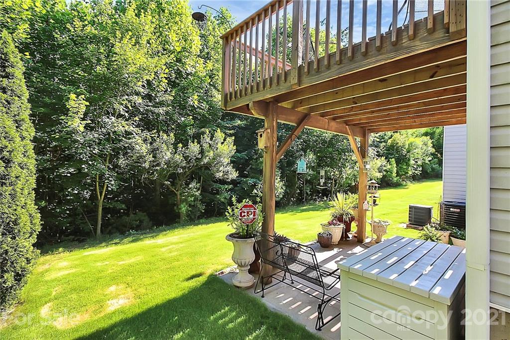 16844 Timber Crossing Road, Unit 2111 Charlotte, NC 28213 - Photo 31 of 33 a view of a swimming pool with a patio