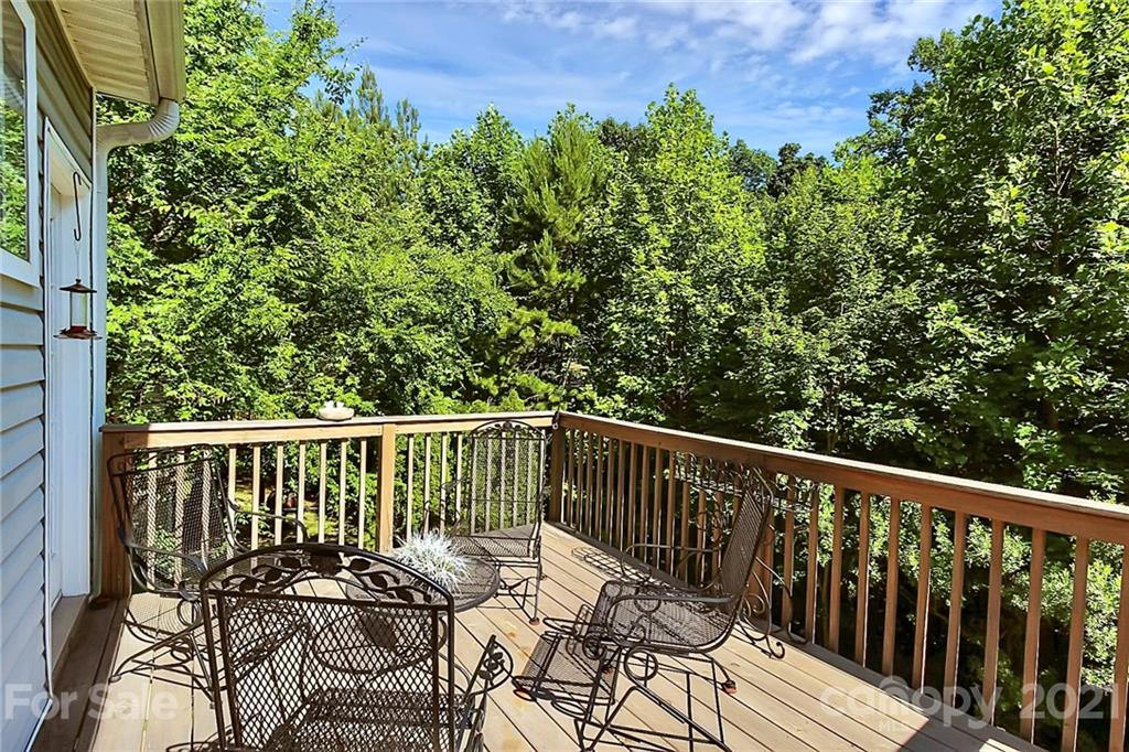 16844 Timber Crossing Road, Unit 2111 Charlotte, NC 28213 - Photo 10 of 33 a view of balcony with wooden floor and fence