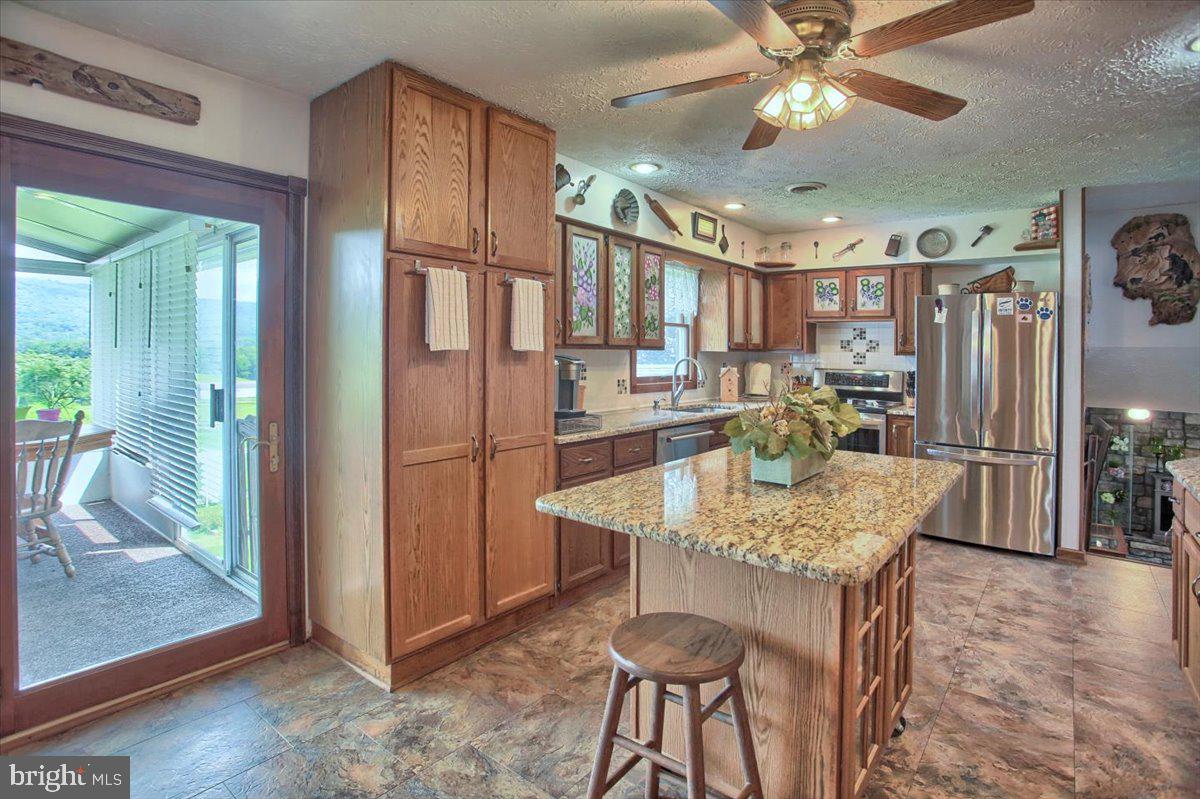 1327 Ridge Road Grantville, PA 17028 - Photo 12 of 42 Slider allows easy flow from kitchen to sunroom