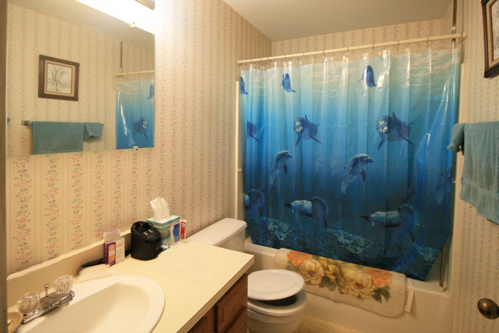 48 Evergreen Road, Unit 306 Northampton, MA 01053 - Photo 7 of 9 a bathroom with a sink and a mirror