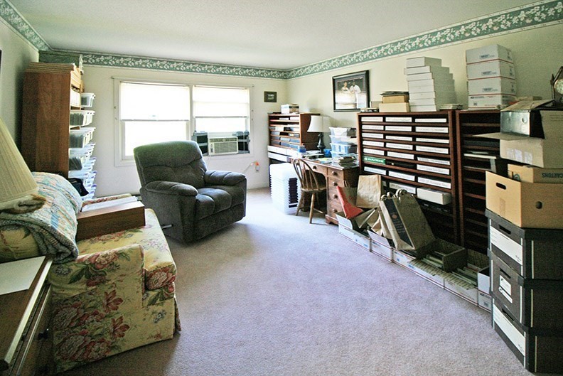 48 Evergreen Road, Unit 306 Northampton, MA 01053 - Photo 8 of 9 a living room with furniture a flat screen tv and a window