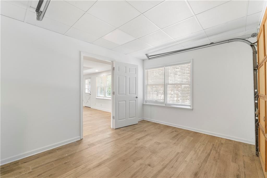 8965 Laurel Way Alpharetta, GA 30022 - Photo 52 of 79 an empty room with wooden floor and windows