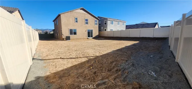 a view of a backyard of a house
