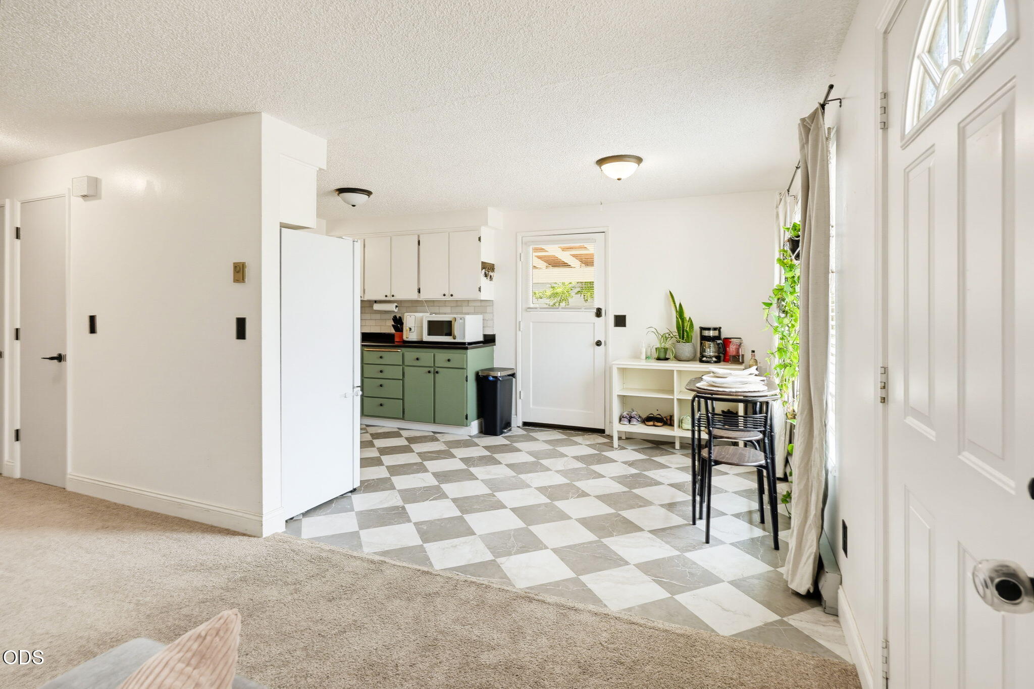 1325 Spring Street Medford, OR 97504 - Photo 5 of 27 a kitchen with stainless steel appliances kitchen island granite countertop a refrigerator and a sink