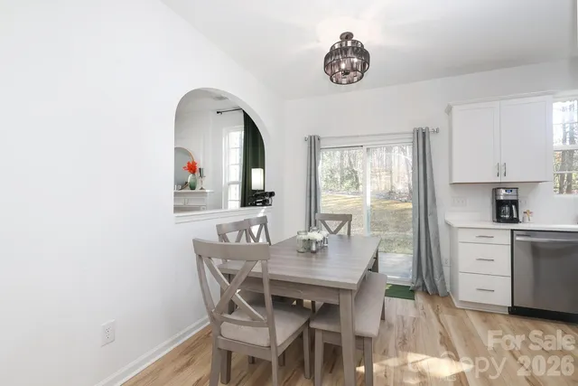 a view of a dining room with furniture and window