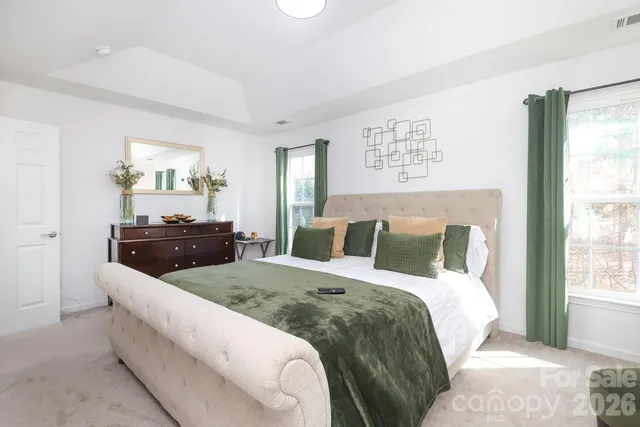 a living room with a couch and a dresser