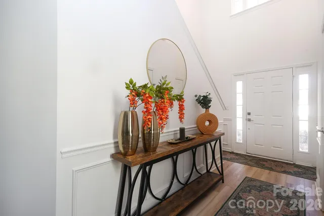 a view of an entryway with wooden floor
