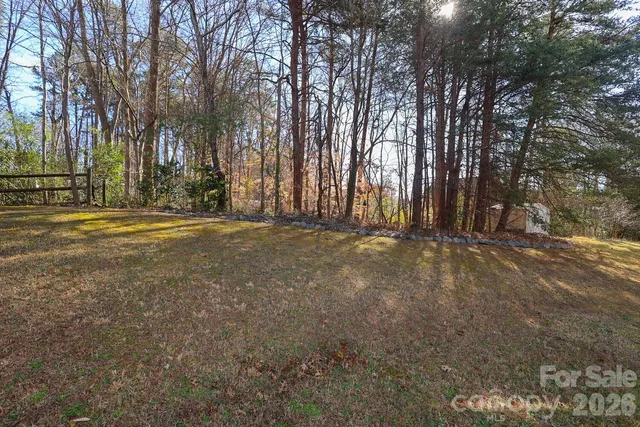 a view of water heater room with wooden fence