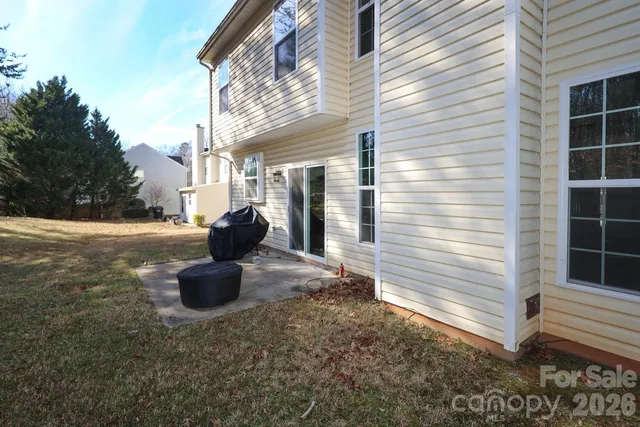 a view of a house with a barbeque