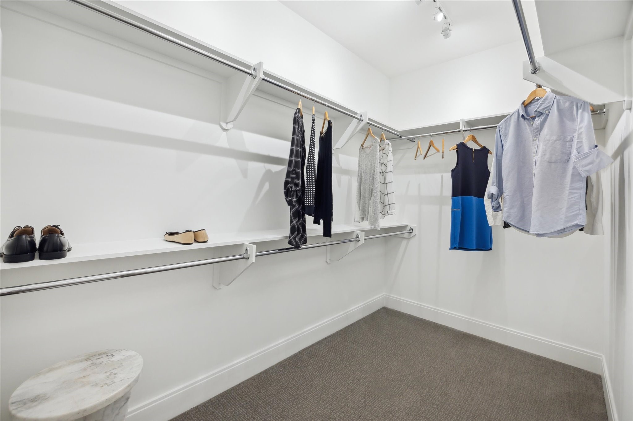 2323 West Main Street, Unit 603 Houston, TX 77098 - Photo 12 of 18 a view of walk in closet with clothes and shoes