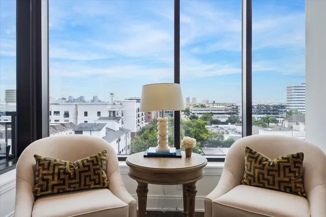 a kitchen with a refrigerator and white cabinets