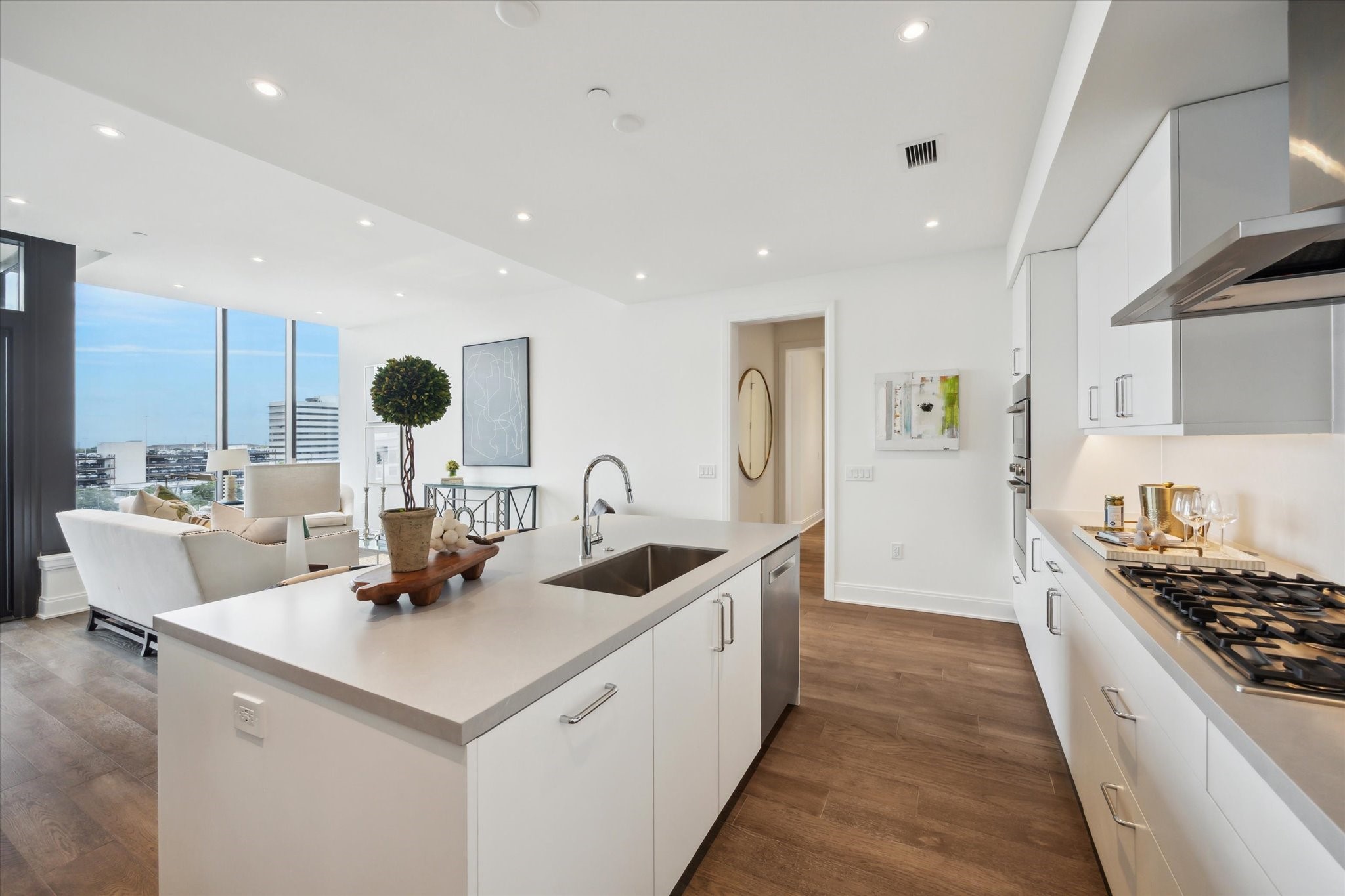 2323 West Main Street, Unit 603 Houston, TX 77098 - Photo 5 of 18 a kitchen with a stove and a sink