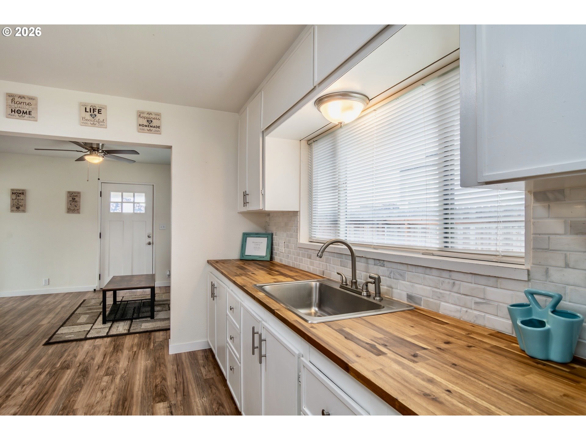 139 South R Street Riddle, OR 97469 - Photo 13 of 33 a kitchen with a sink a window and cabinets