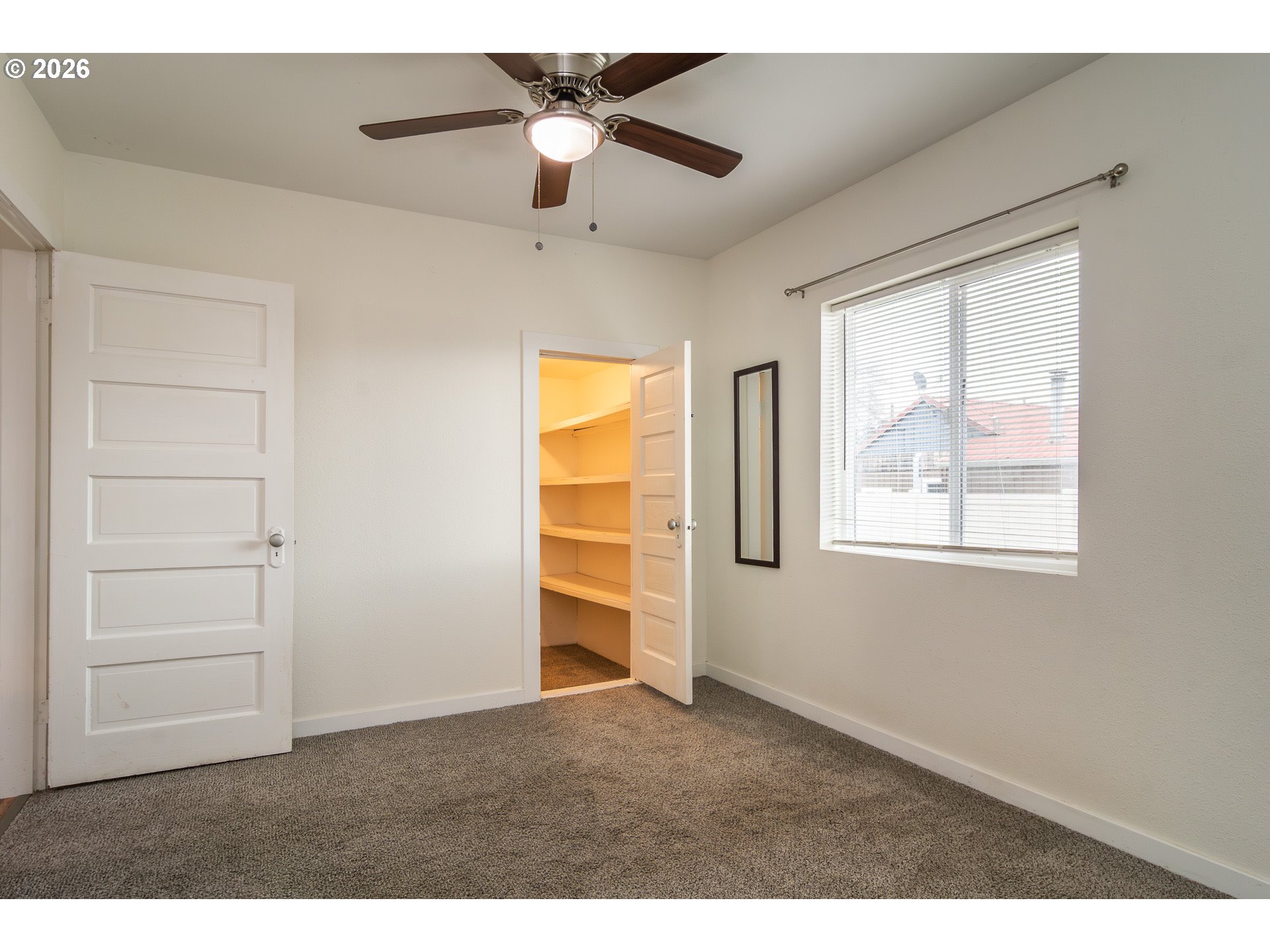 139 South R Street Riddle, OR 97469 - Photo 18 of 33 a view of an empty room with a window