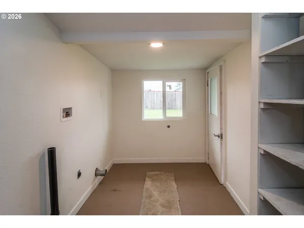 a view of an empty room with a window