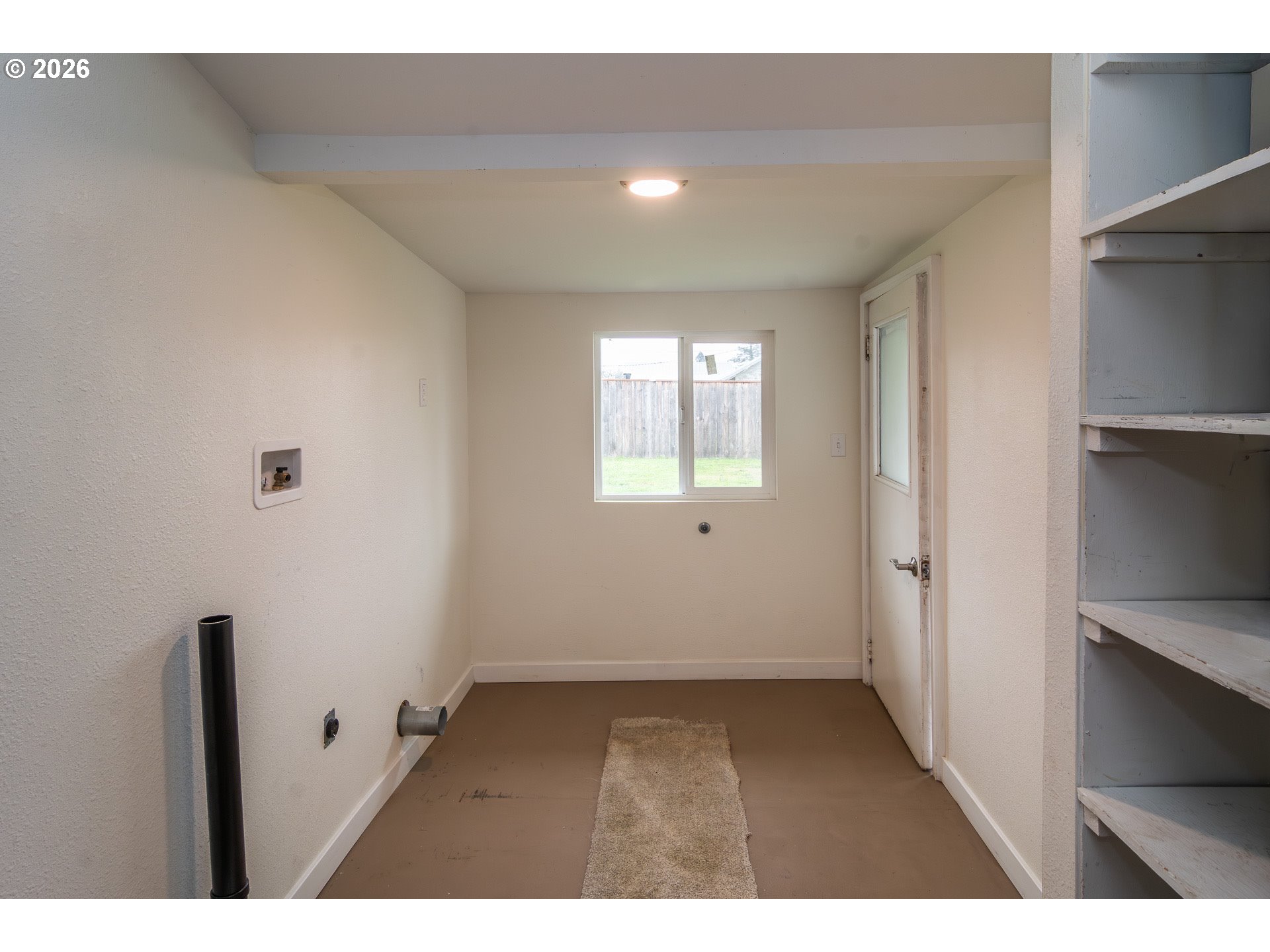 139 South R Street Riddle, OR 97469 - Photo 24 of 33 a view of an empty room with a window