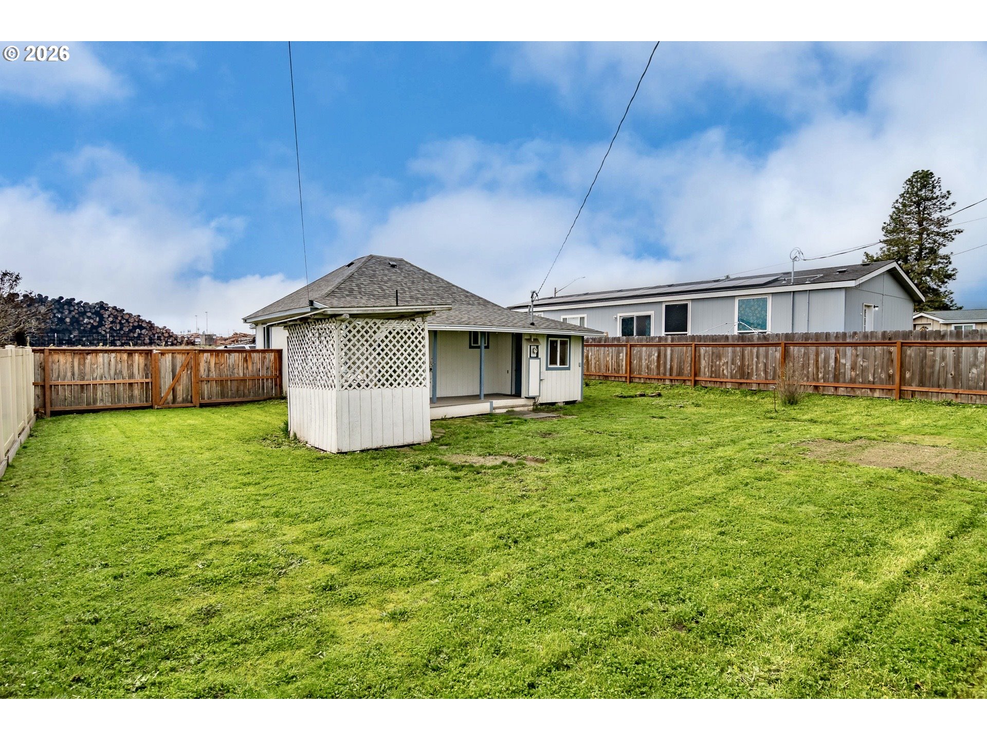 139 South R Street Riddle, OR 97469 - Photo 28 of 33 a front view of a house with a garden