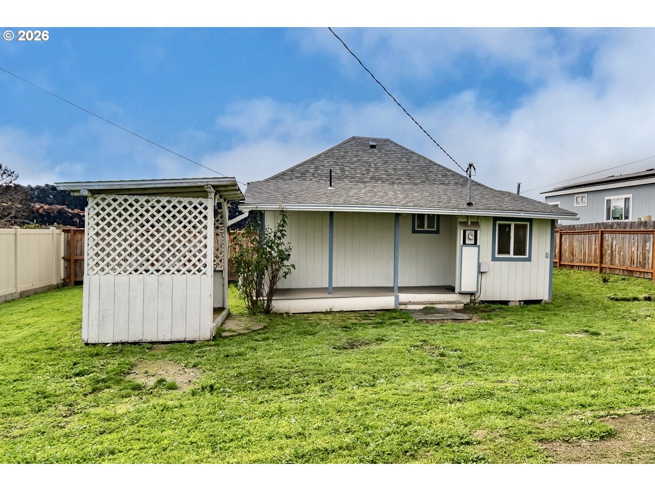 139 South R Street Riddle, OR 97469 - Photo 29 of 33 a backyard of a house with lots of green space