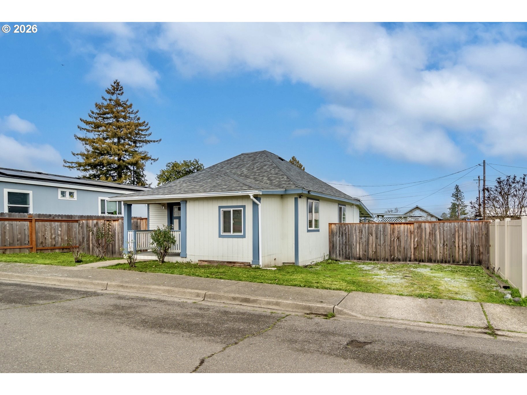 139 South R Street Riddle, OR 97469 - Photo 3 of 33 a view of a yard in front of a house