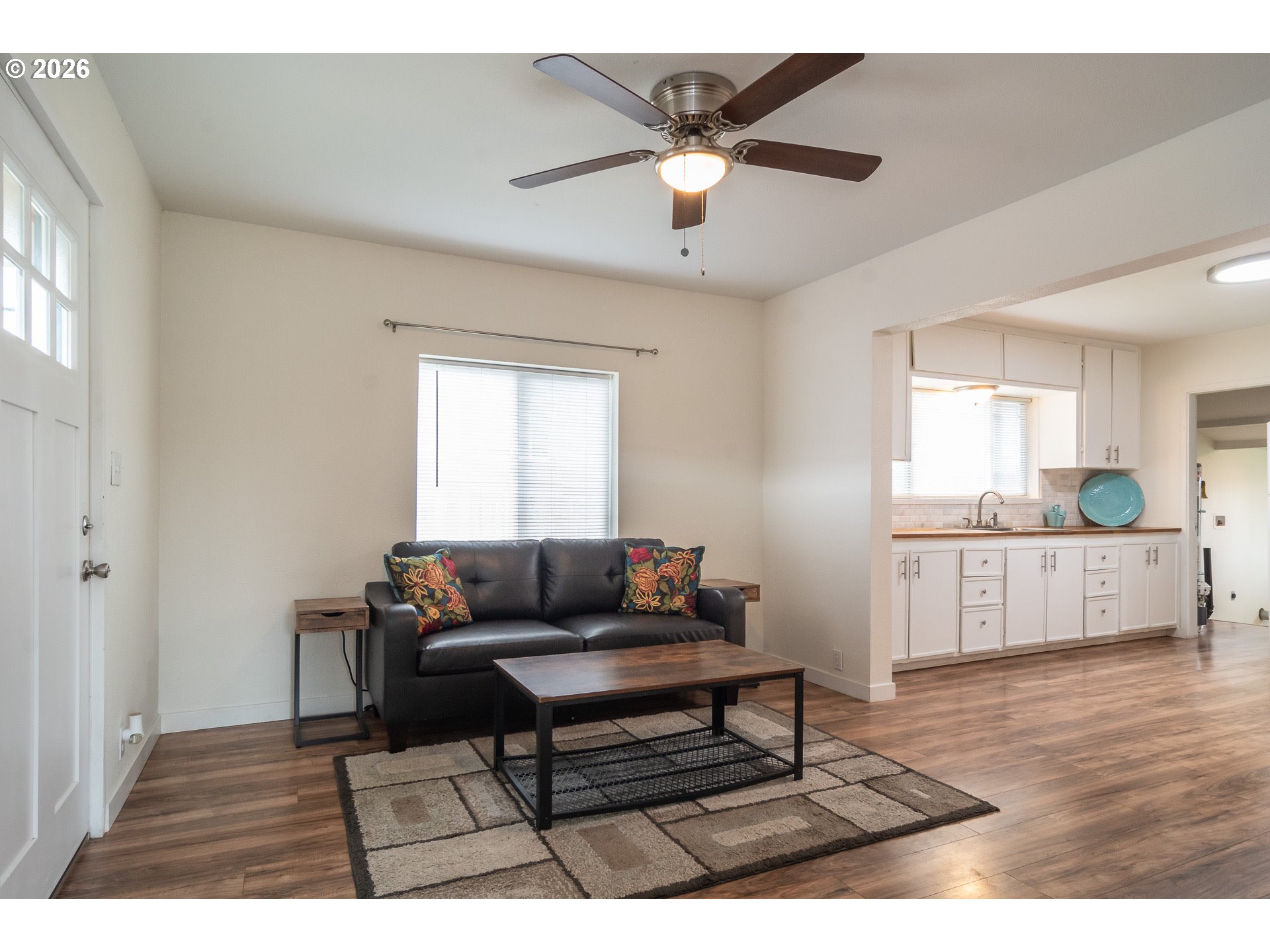 139 South R Street Riddle, OR 97469 - Photo 4 of 33 a living room with furniture and a wooden floor