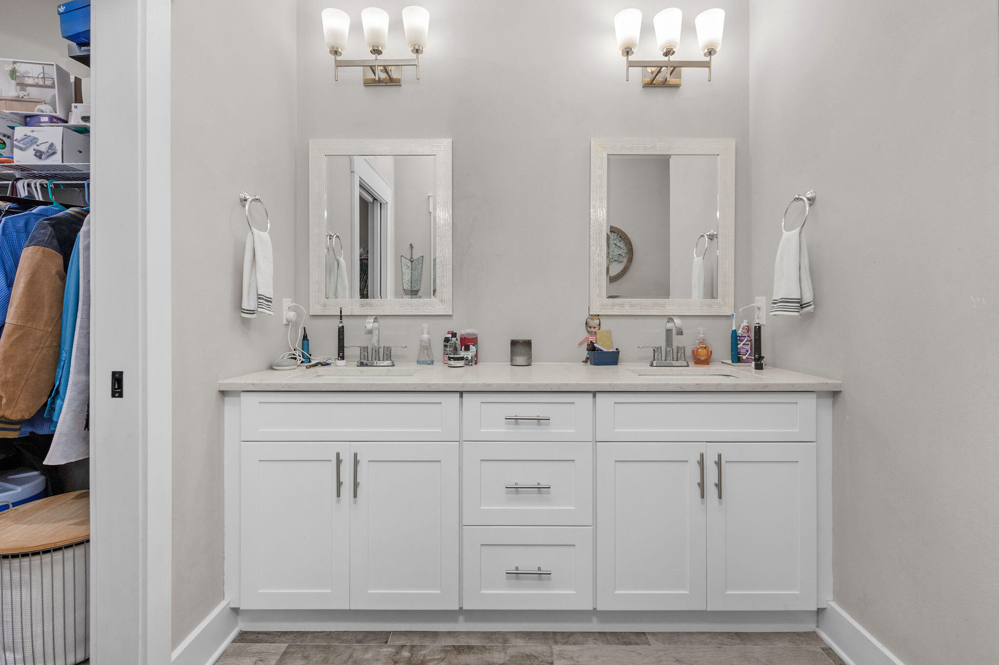 8914 Timber Lane Navarre, FL 32566 - Photo 21 of 40 a bathroom with double vanity sink a mirror and a vanity