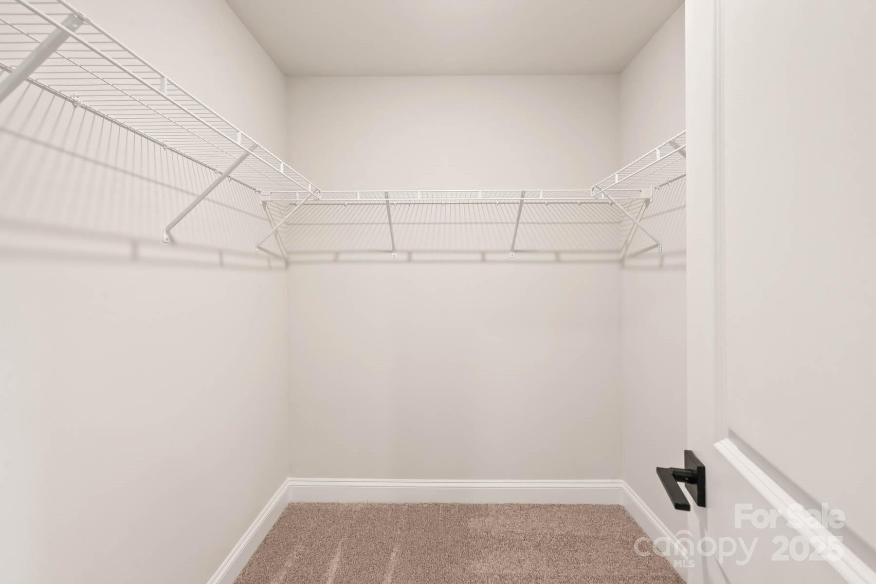 109 Rills Xing Way Troutman, NC 28166 - Photo 15 of 19 a view of a room with racks on the wall