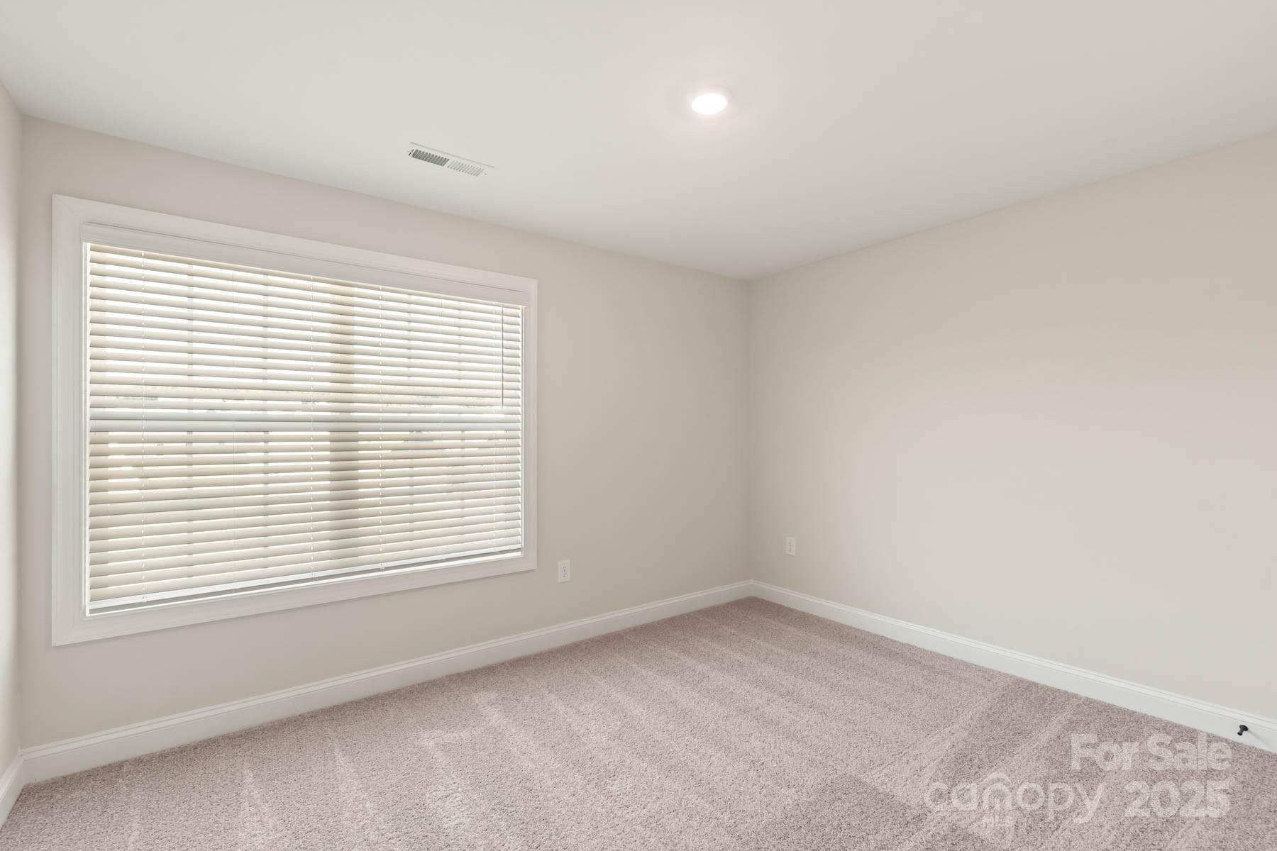109 Rills Xing Way Troutman, NC 28166 - Photo 17 of 19 an empty room with a window