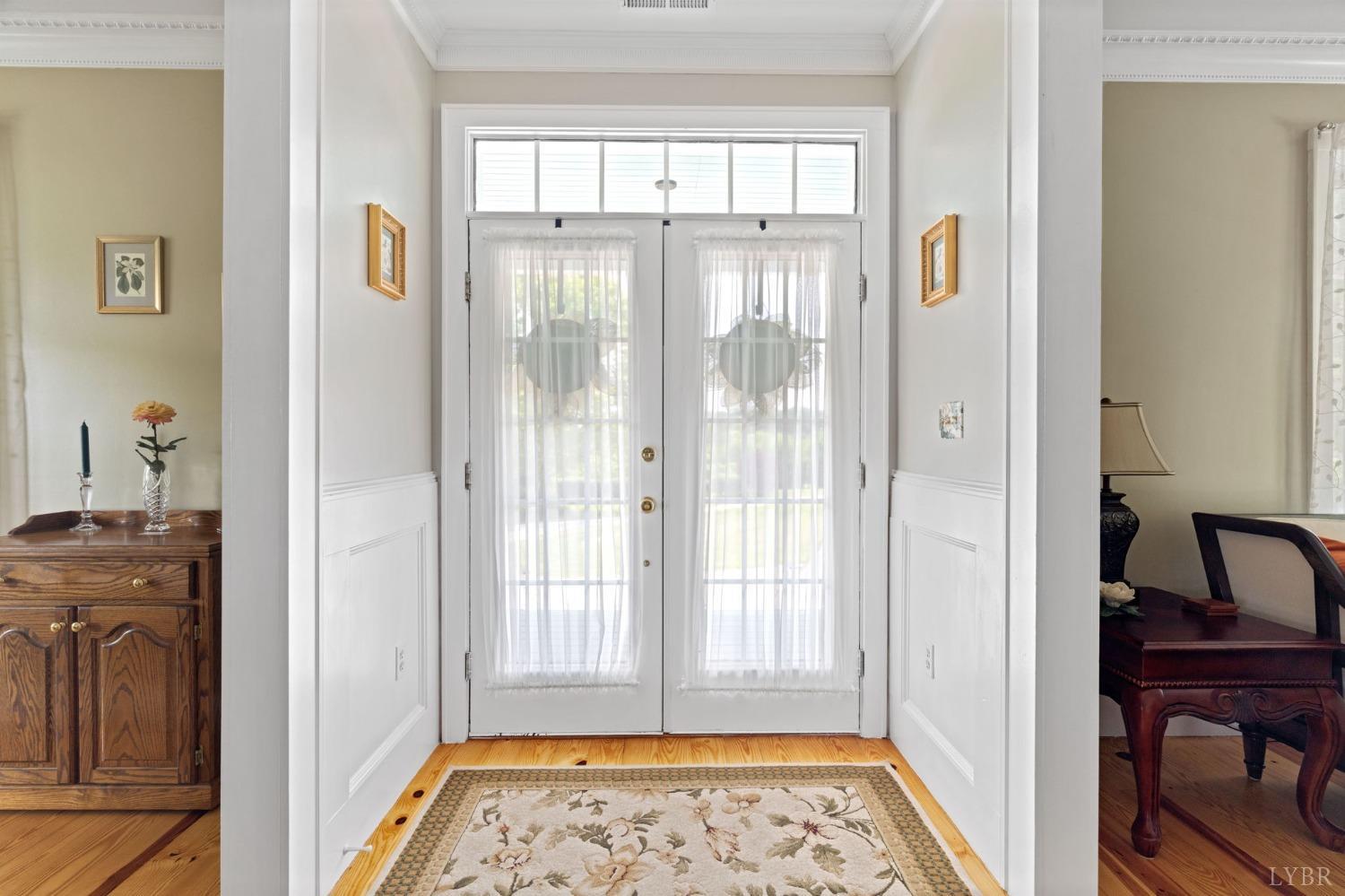 3297 Midway Road Phenix, VA 23959 - Photo 24 of 89 a view of an entryway with wooden floor and a bedroom