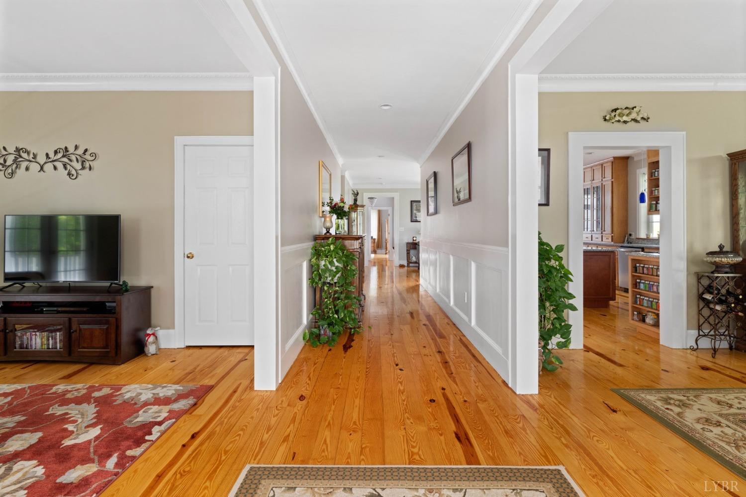 3297 Midway Road Phenix, VA 23959 - Photo 25 of 89 a room with wooden floor and a flat screen tv