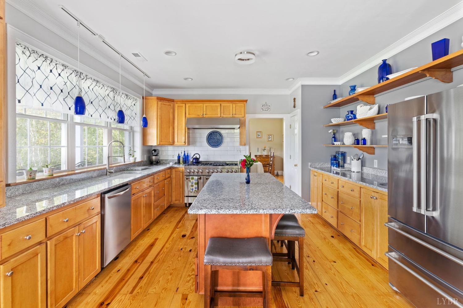 3297 Midway Road Phenix, VA 23959 - Photo 33 of 89 a large kitchen with granite countertop a large window a sink and stainless steel appliances