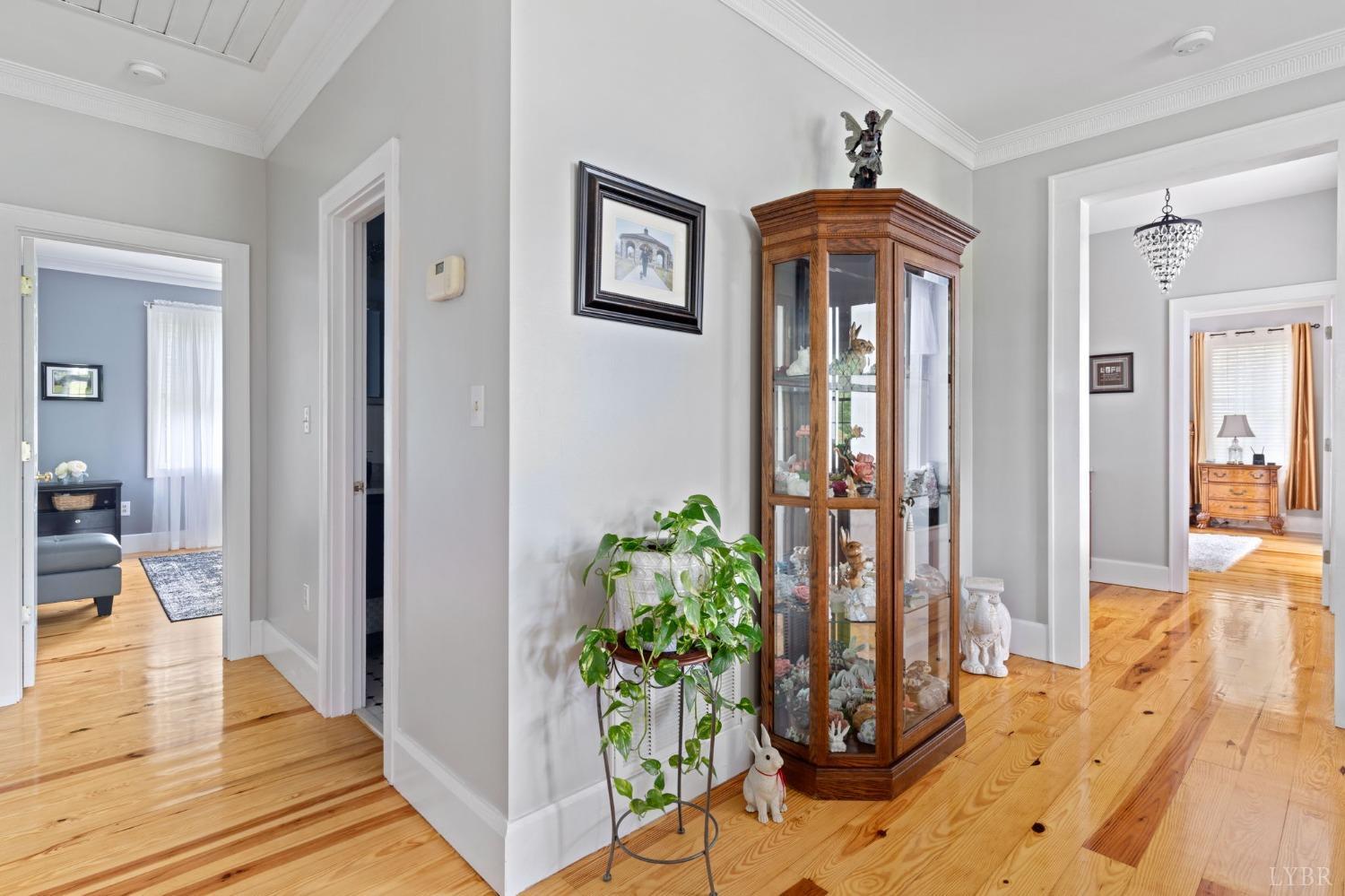 3297 Midway Road Phenix, VA 23959 - Photo 38 of 89 a view of a hallway with wooden floor and a chandelier