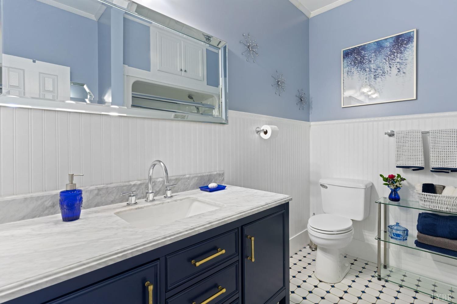 3297 Midway Road Phenix, VA 23959 - Photo 39 of 89 a bathroom with a sink a toilet and a mirror