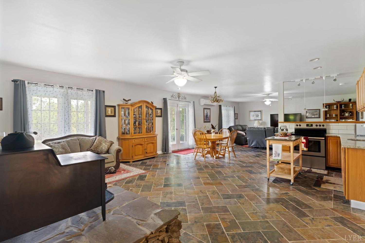 3297 Midway Road Phenix, VA 23959 - Photo 59 of 89 a living room with furniture and a dining table with kitchen view