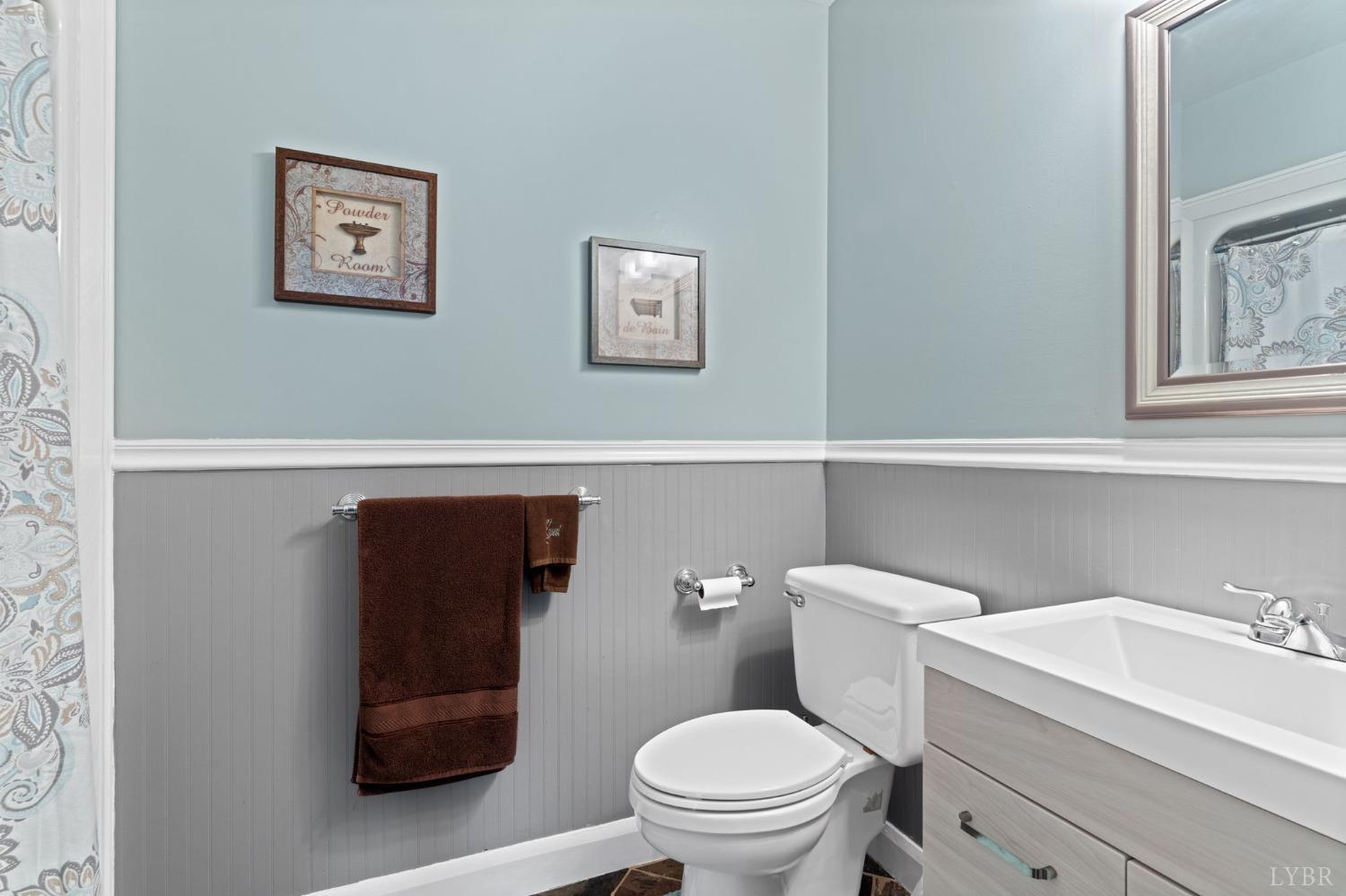 3297 Midway Road Phenix, VA 23959 - Photo 60 of 89 a white toilet sitting next to a bathroom sink