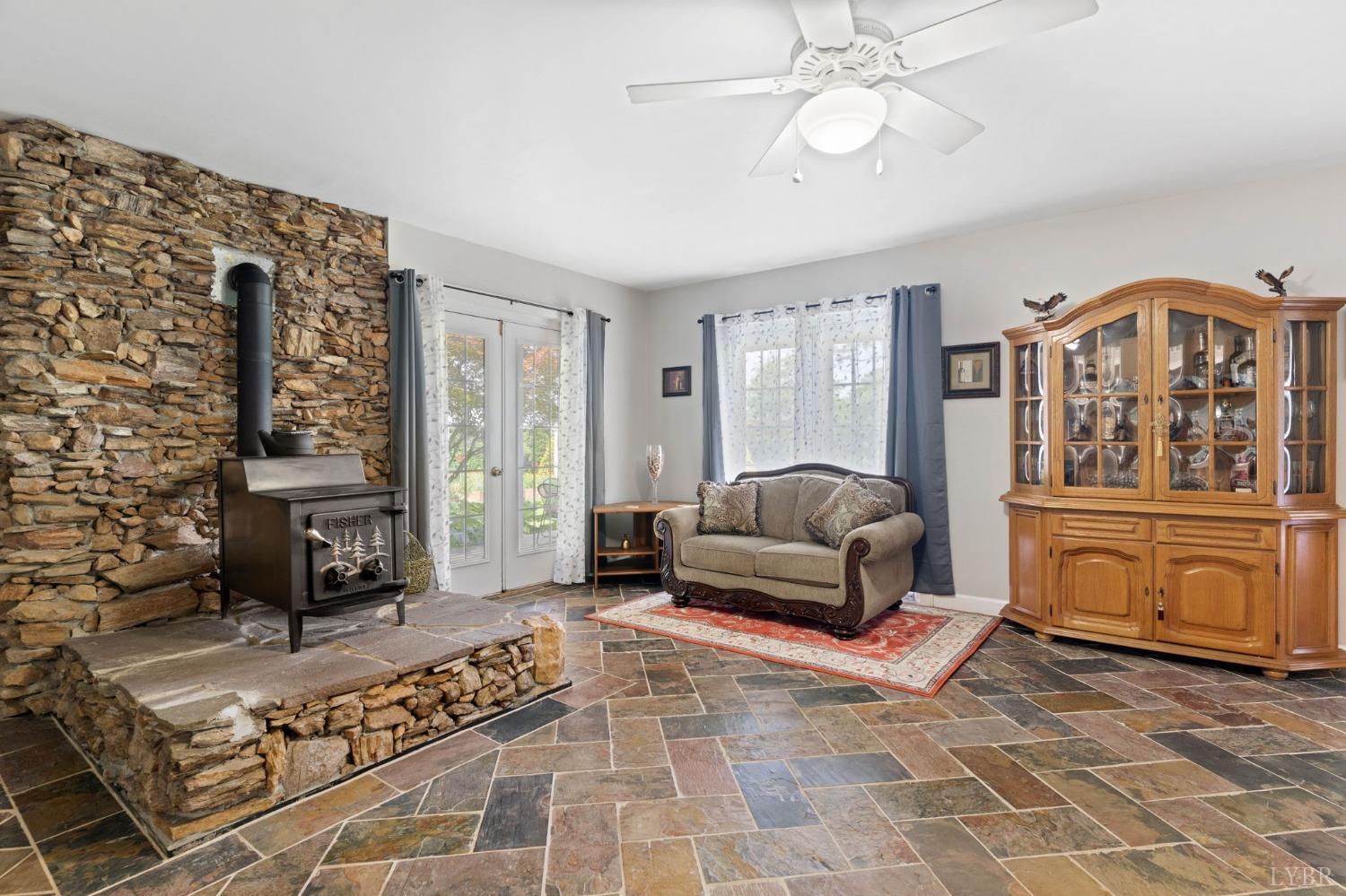 3297 Midway Road Phenix, VA 23959 - Photo 61 of 89 a living room with furniture and a fireplace