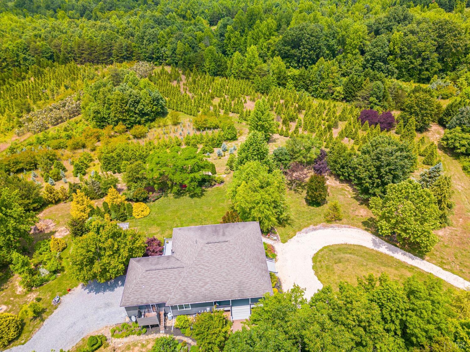 3297 Midway Road Phenix, VA 23959 - Photo 86 of 89 an aerial view of residential house with swimming pool and lawn chairs
