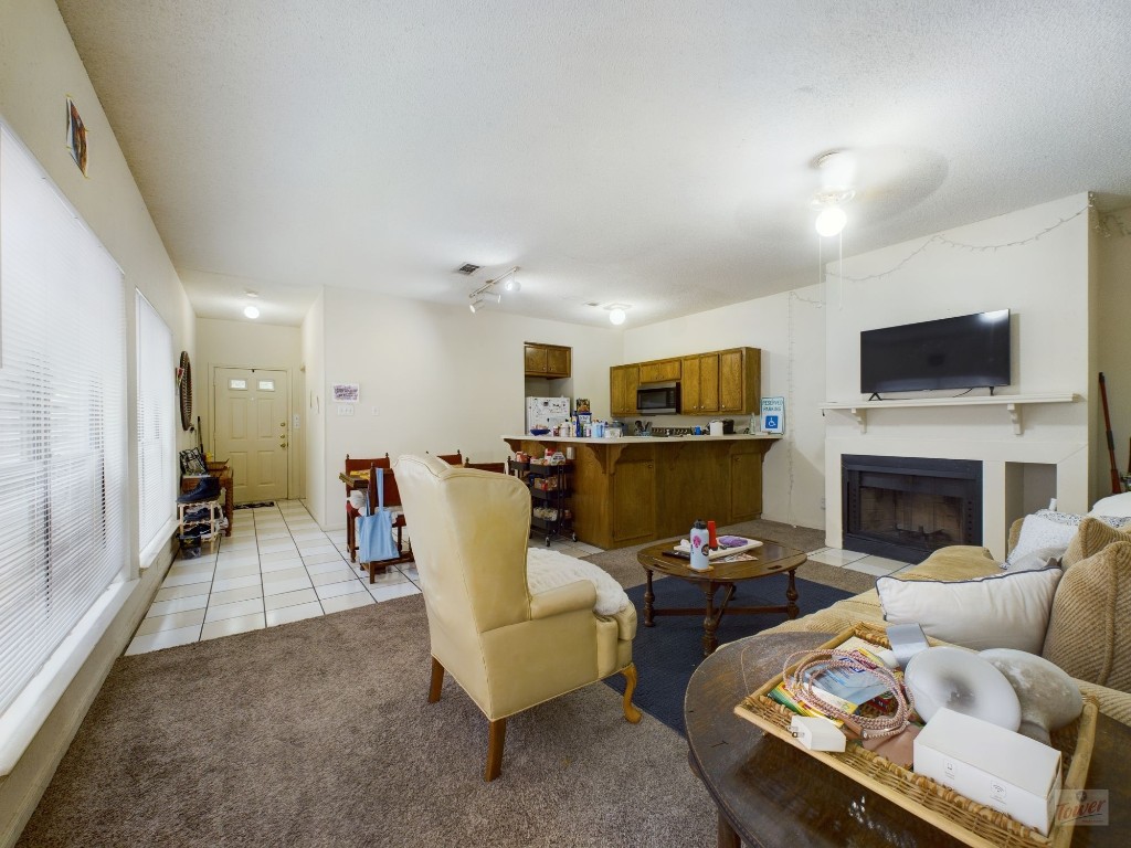 4111 Speedway, Unit 2 Austin, TX 78751 - Photo 6 of 14 a living room with furniture and a fireplace