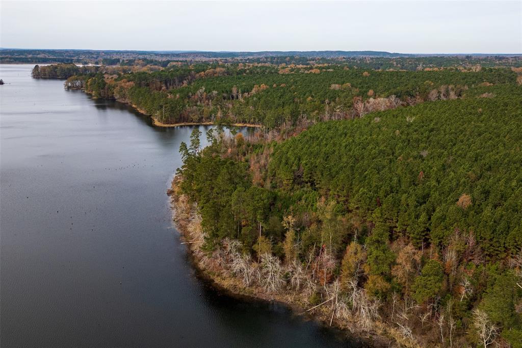 0 County Road 1211 Center, TX 75935 - Photo 21 of 38 an aerial view of residential houses with outdoor space and river