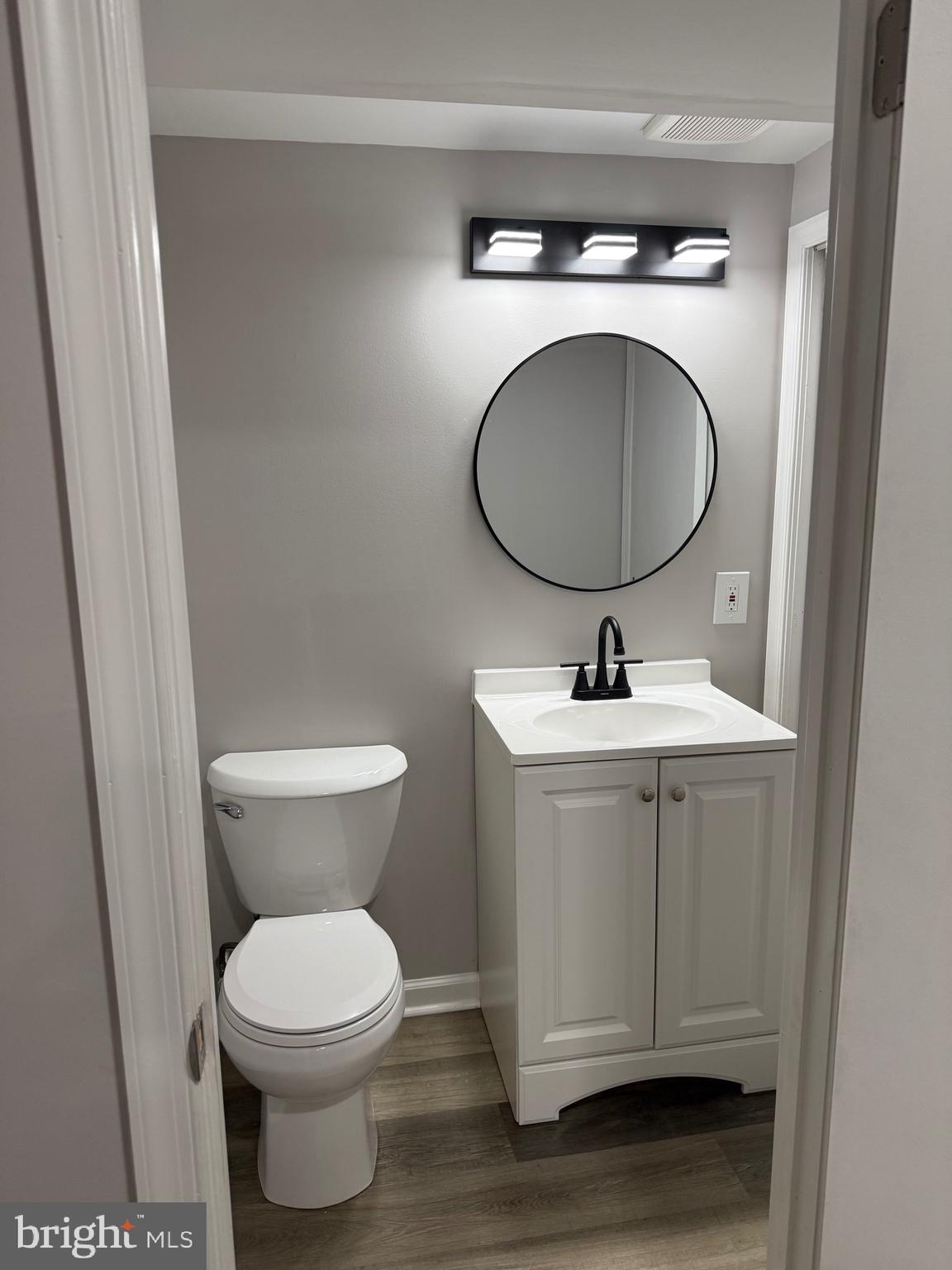 802 Fairview Road Swarthmore, PA 19081 - Photo 16 of 18 a bathroom with a toilet a sink and mirror