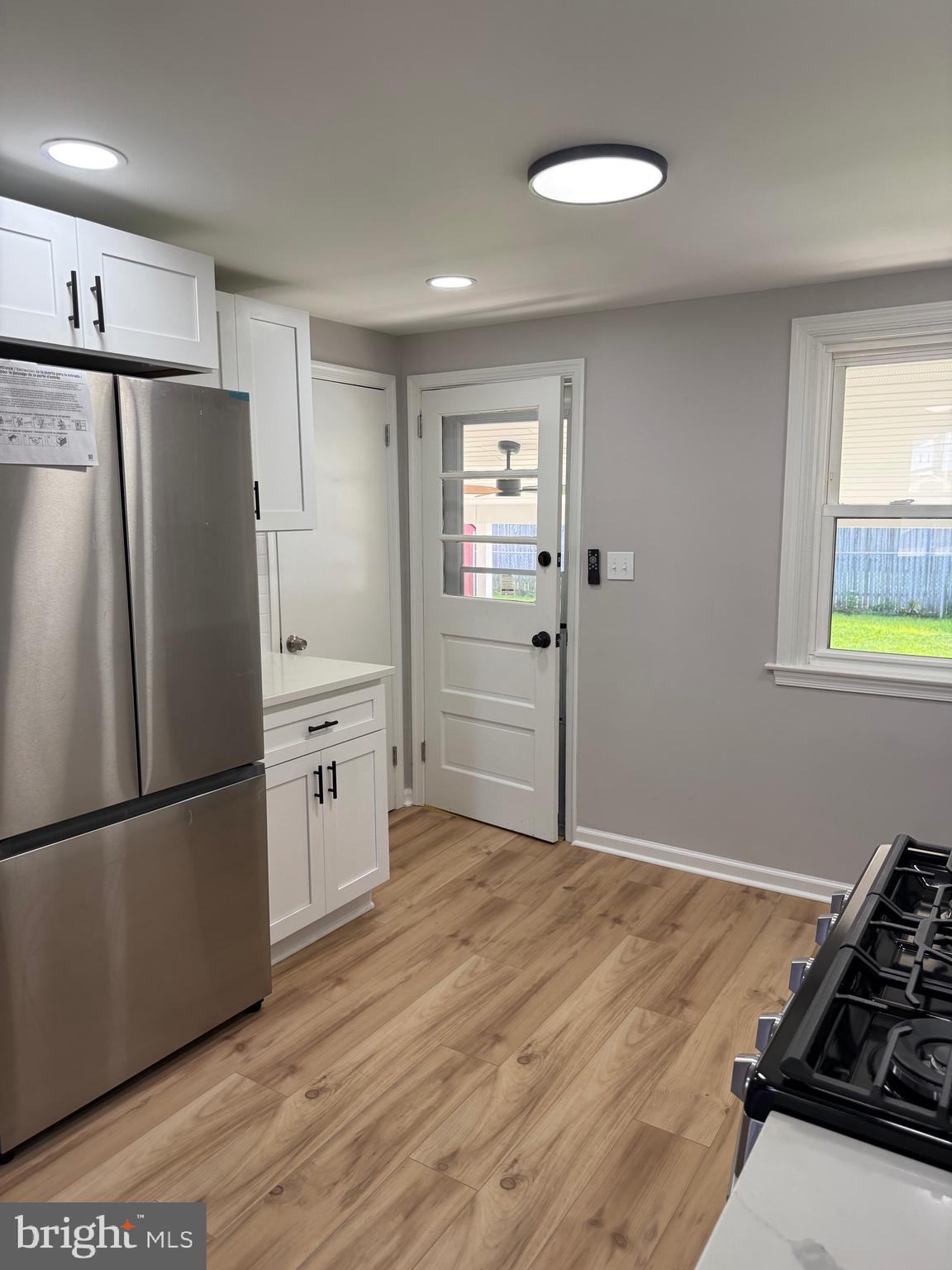 802 Fairview Road Swarthmore, PA 19081 - Photo 8 of 18 a kitchen with a refrigerator and a stove top oven